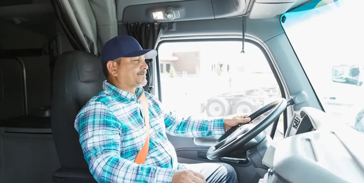Man driving a semi-truck in a second chance trucking opportunity.