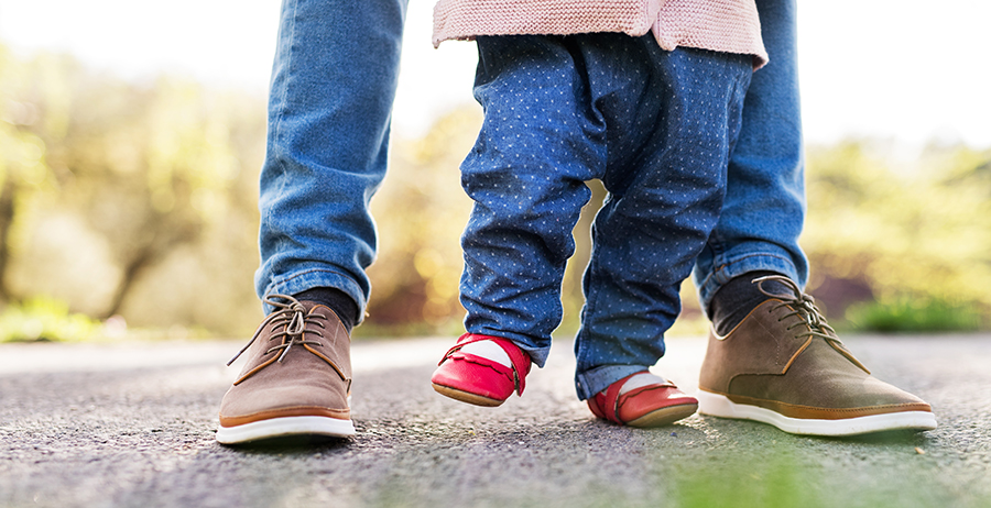 Image shows an old photo of Marcus teaching his daughter Mia who he now wants to reestablish a relationship, to walk